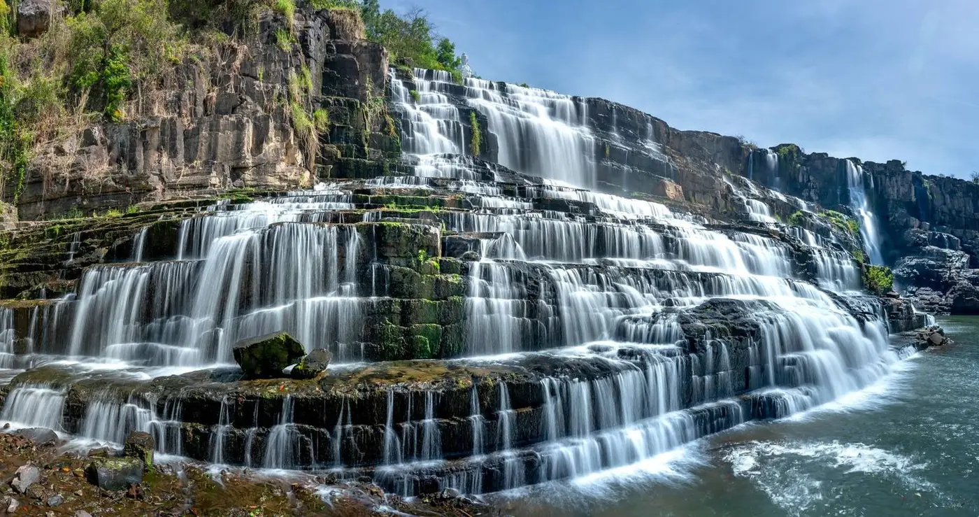 Pongour waterfall cascading over wide stone terraces near Dalat