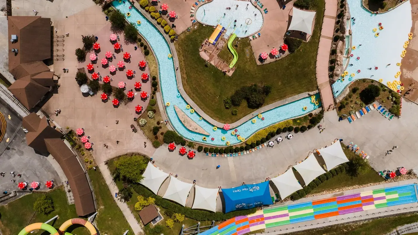 Aerial view of a water park with colorful slides and pools