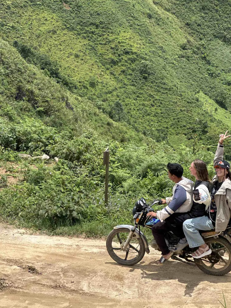 Riders on a dirt mountain road along the Ha Giang loop