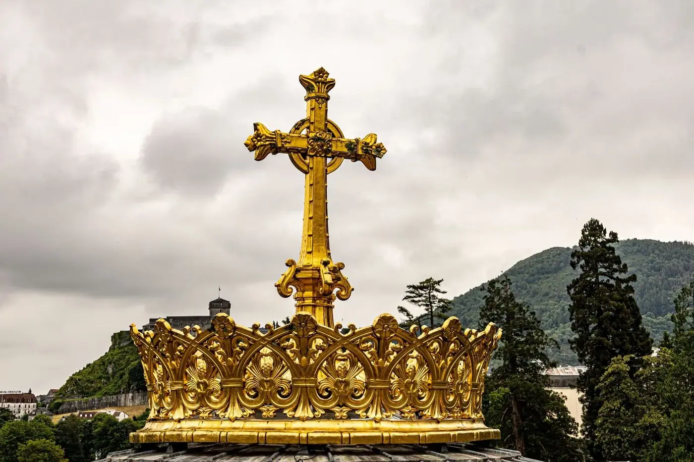 Golden cross monument on Vietnamese hilltop Vung Tau