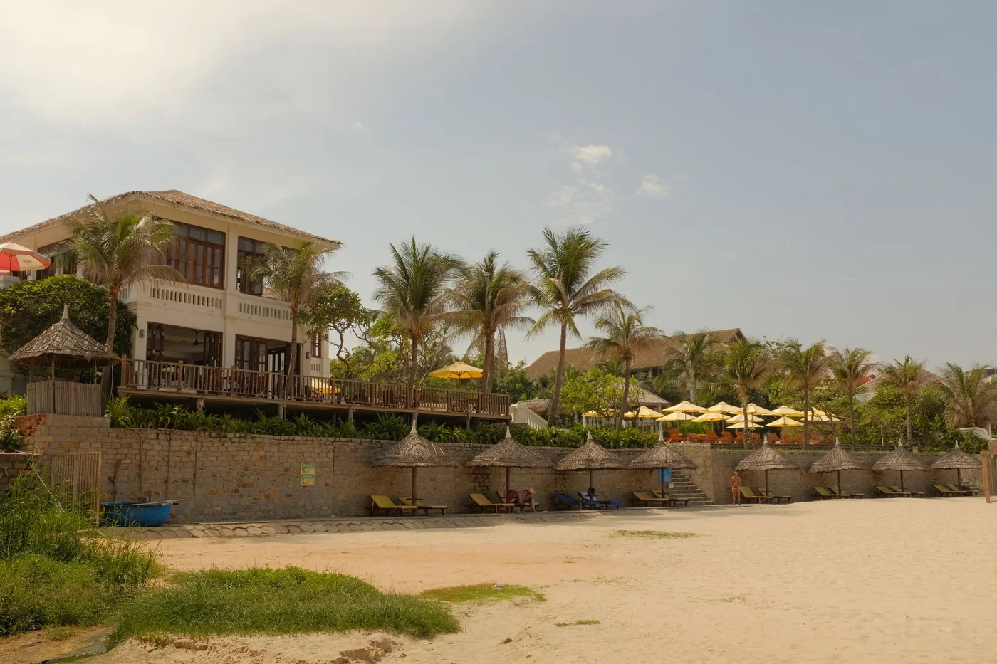 Beachfront resort on the Vietnam coast with palm trees